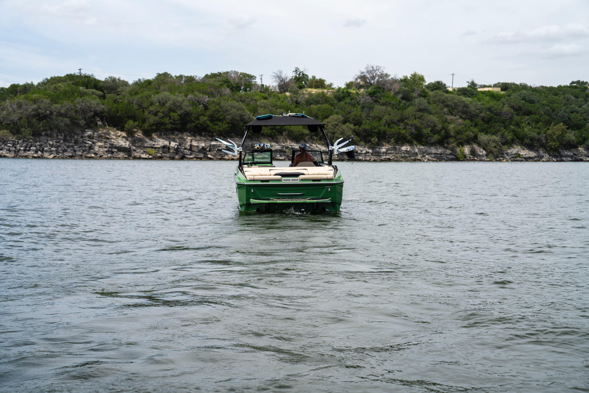 Supreme wake boat cruising on Lake Travis
